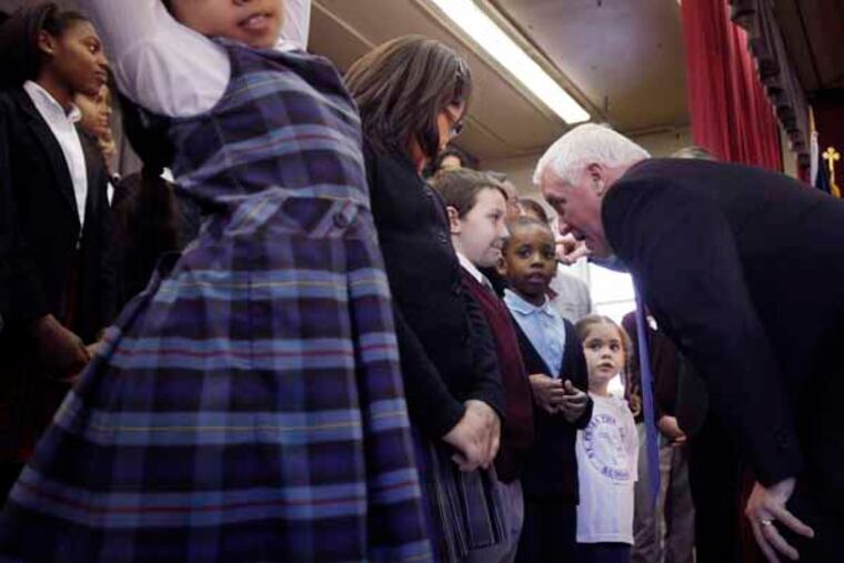Governor Tom Corbett talks with St. Martin of Tours third grader Bryant Howe, 8, after the rally. Howe fainted earlier as Corbett was speaking but was alright at the end of the rally. The Independence Mission Schools introduces their leadership at a rally held at St. Martin of Tours Elementary School as it forms an independently managed Catholic elementary school system.( MICHAEL S. WIRTZ / Staff Photographer ). January 16, 2013.