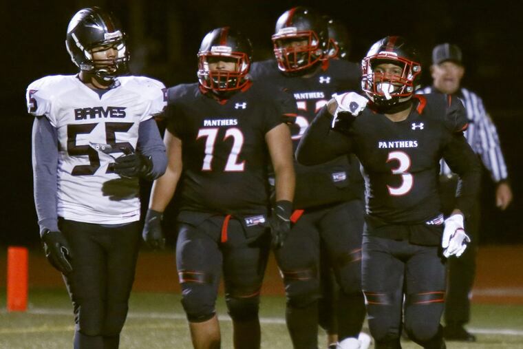 Imhotep running back Isheem Young (right) celebrates after scoring a touchdown against Bartram in the third quarter of the Public League Class 4A football final Saturday, Nov. 11, 2017. Imhotep followed that win up with a victory over Cardinal O’Hara in the District 12 Class 4A final.