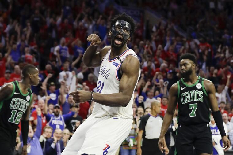 Sixers center Joel Embiid celebrates a dunk during the third quarter on Monday.