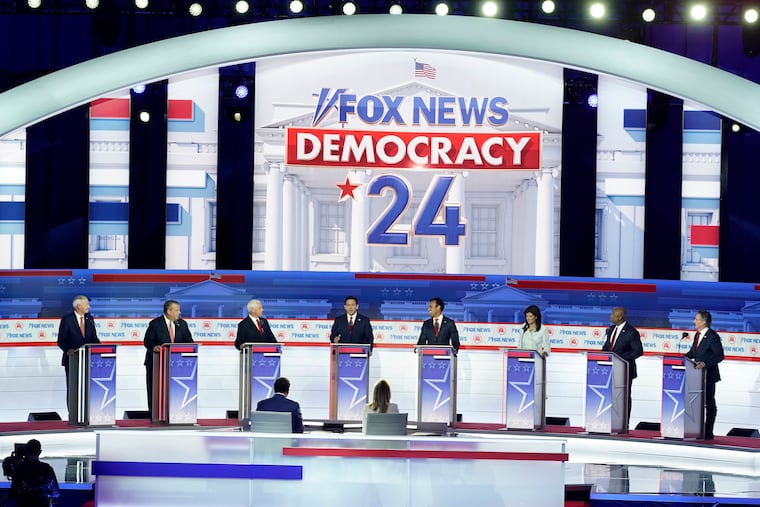 Republican presidential candidates (from left) Asa Hutchinson, Chris Christie, Mike Pence, Ron DeSantis, Vivek Ramaswamy, Nikki Haley, Tim Scott, and Doug Burgum during the Republican presidential primary debate Wednesday.