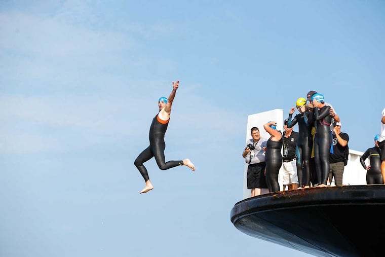 JRACE04 More than 1700 athletes will test their mettle Sunday at the Escape the Cape Triathlon near Cape May. But first they have to jump off the Cape May-Lewes Ferry into the C & D Canal to complete the swimming portion of the race.