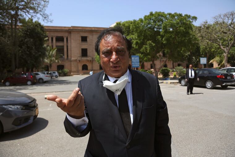 Khwaja Naveed, lawyer of Ahmed Omar Saeed Sheikh who found guilty of the kidnapping and murder of Wall Street Journal reporter Daniel Pearl, speaks to reporters outside a court in Karachi, Pakistan.