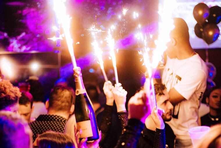 Waitresses performing bottle service in 2022 at Vesper, the nightclub near Rittenhouse Square that Tim Lu, the co-founder of Glu Hospitality, formerly operated. Lu is being sued by a former investor over his attempt to buy the club.
