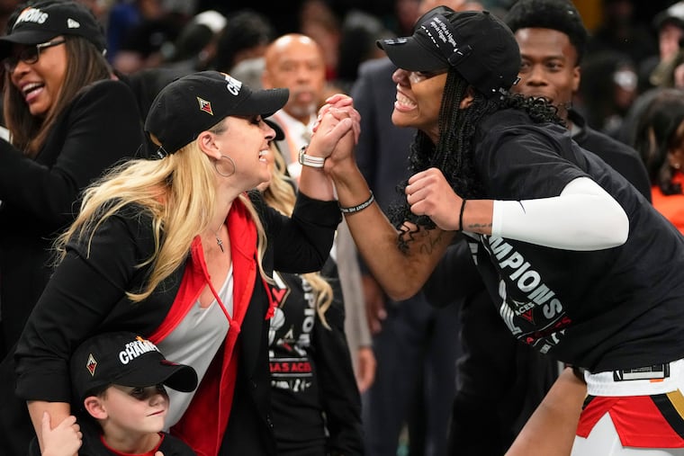 Las Vegas Aces head coach Becky Hammon (left) celebrates with A'ja Wilson after beating the New York Liberty in Game 4 of the WNBA Finals. Hammon, Wilson, and the Aces won the title for the second consecutive season.