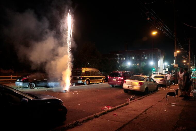 Fireworks shoot into the sky in North Philadelphia.
