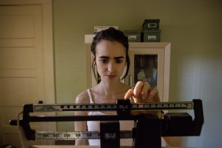 This image released by Netflix shows Lily Collins in “To The Bone.”