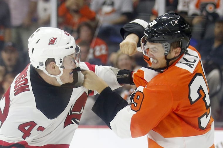 Mark Alt fights New Jersey Devils Ben Thomson during the second-period in a preseason game in 2016.