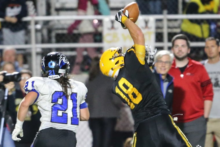 CB West’s Donald McCauley intercepts the ball intended for Quakertown’s Michael Terra during the fourth quarter at War Memorial Field in Doylestown Friday, September 8, 2017. CB West beats Quakertown 20-0.