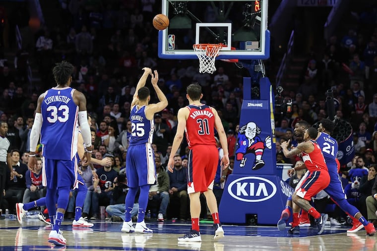 Ben Simmons takes a free throw after getting fouled intentionally by the Wizards in the fourth quarter.