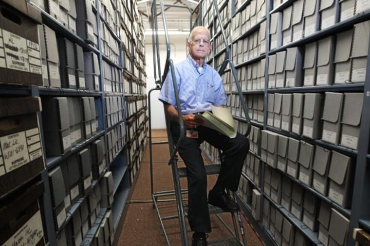 Archives Director Robert Plowman sits in the storage and filing area of the archives that are being slowly transferd to archival storage. Delaware County has its own Archives which preserves and houses historical documents from 1789 to 2010. The newest addition is a veteran's grave registration. ( MICHAEL BRYANT / Staff Photographer )