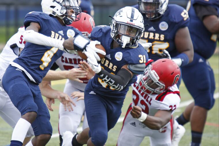 West Catholic running back Jacir Savoy looks for running room against Archbishop Carroll during the second quarter of a Catholic League Blue Division football game Saturday, Sept. 15, 2018, at Maguire Field in West Philly. West Catholic went on to win in overtime, 36-35.