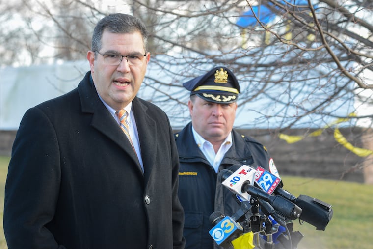 Gregg Shore (left) was demoted to deputy district attorney on Thursday, after his superiors learned he had been delivering food for DoorDash during business hours. Shore, seen here in February 2020, was essentially second-in-command of the district attorney's office under District Attorney Matthew Weintraub.