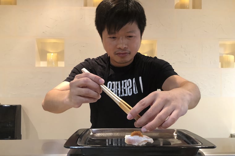 Sam Lin finishing a dish at Sakana, 616 S. Second St.