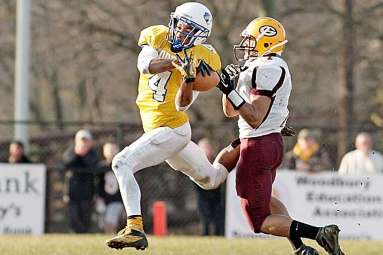 Woodbury's Anthony Averett intercepts a pass intended for Glassboro's Ronnie James. (Elizabeth Robertson/Staff Photographer)