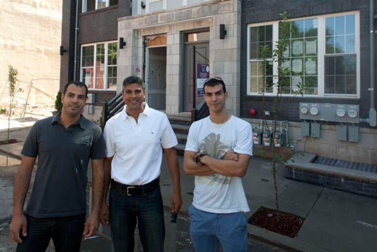 (From left) Shimon Levy, Netanel Levi, and Bar Levi began buying lots on N. Sixth Street in Old Kensington in 2006. They created a market for new construction and built a successful family business, as well.