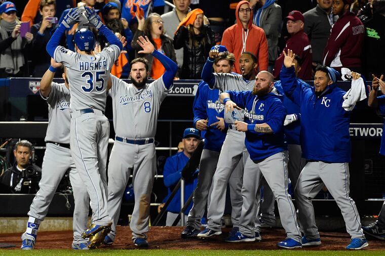 Kansas City Royals first baseman Eric Hosmer (35) celebrates with teammates after scoring a run against the New York Mets in the 9th inning in game five of the World Series at Citi Field.