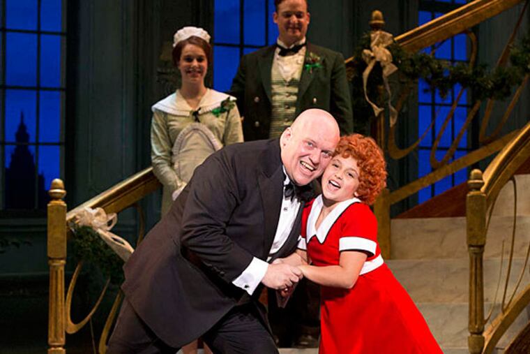 The musical "Annie" at the Academy of Music stars Issie Swickle in the title role and Gilgamesh Taggett as Daddy Warbucks. (JOAN MARCUS)