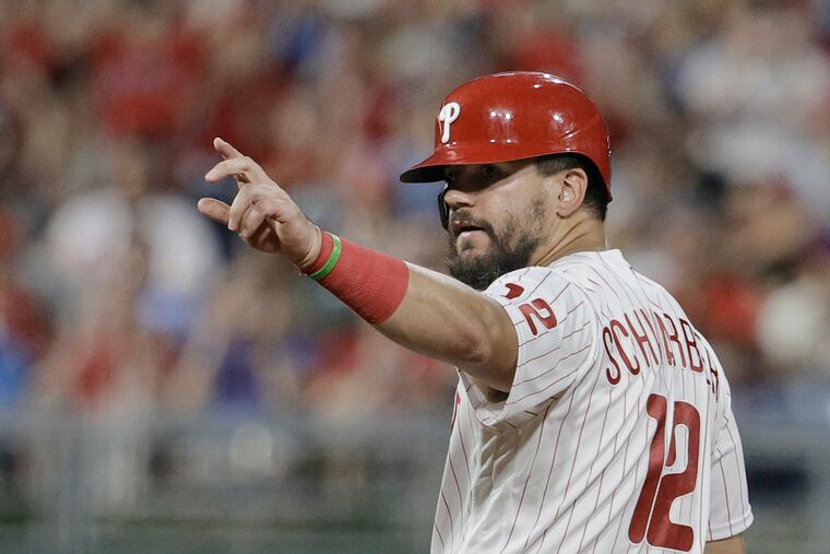 Phillies Kyle Schwarber signals to the dugout after stealing second base in the fourth inning of the Miami Marlins at Philadelphia Phillies Major League baseball game at Citizens Bank Park in Phila., Pa. on Aug. 10, 2022.