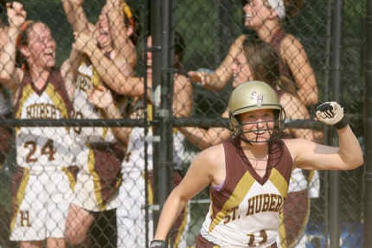 St. Hubert's sophomore Kathleen MacFeeters, who entered the game as a pinch-runner, celebrates after scoring what turned out to be the only run of the game in the seventh inning.