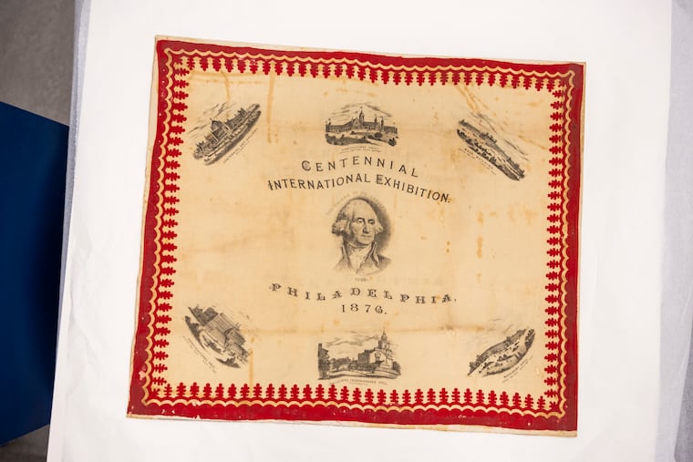 Alexandra Cade, Assistant Curator, of Lower Merion, showing some scarves for the Centennial International Exhibition at the Museum of American Revolution in Philadelphia, Pa., on Tuesday., May 5, 2026.