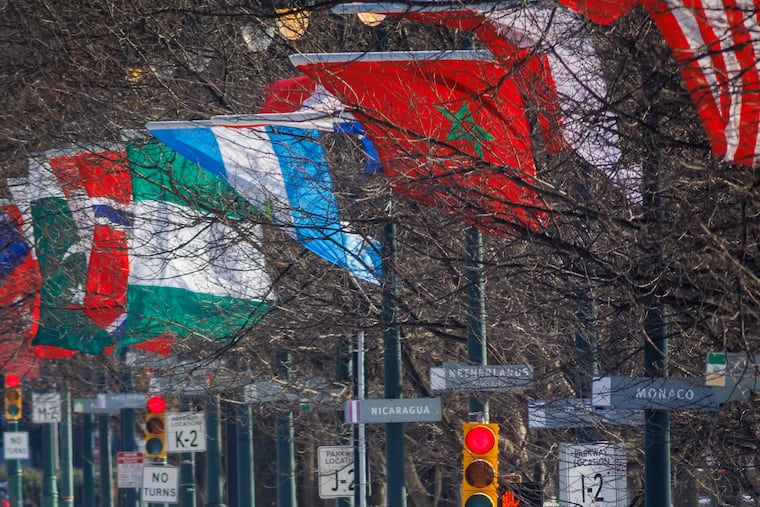 Flags are flapping on a windy afternoon along Ben Franklin Parkway in Philadelphia, Tuesday, Jan. 7, 2025.