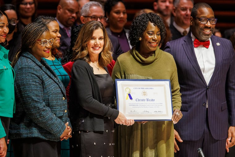 City Controller Christy Brady stands alongside Mayor Cherelle L. Parker after taking the oath of office at the 2026 Inaugural Ceremony at the Kimmel Center Performing Arts on Monday. On Parker's left is City Council President Kenyatta Johnson.