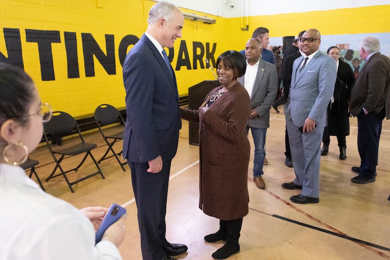 U.S. Sen. Bob Casey talks to Latanya Byrd, a Philadelphia resident who lost four loved ones to an accident on Roosevelt Boulevard.