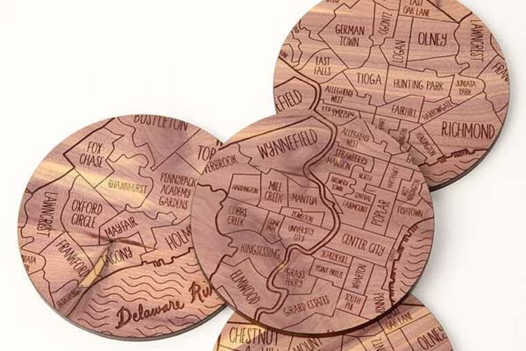 Neighborhood Map Coasters not only save your coffee table from water rings, these attractive cedar resting places are laser-engraved with the boundaries of Philadelphia neighborhoods. $36 for set of four. www.UncommonGoods.com