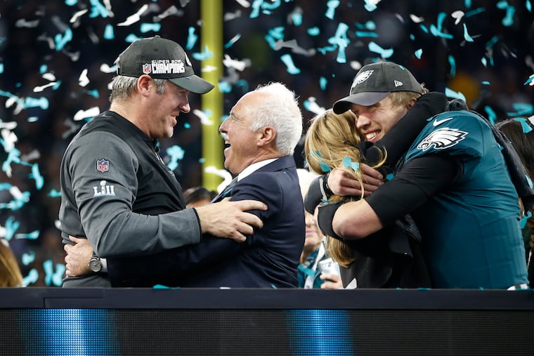 Jeffrey Lurie embraced Doug Pederson (left) after the Eagles' Super Bowl victory three years ago. Now the Eagles owner is shopping for Pederson's replacement.