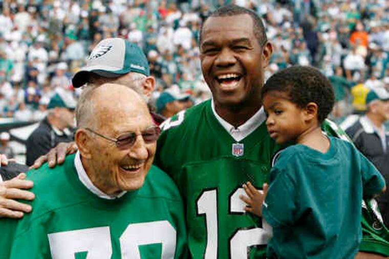 Eagles stars Al Wistert and Randall Cunningham (right) were inducted into the team's honor roll. Wistert (1943-51) was an all-pro offensive tackle and Cunningham (1985-95) a quarterback.