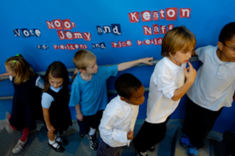 First-graders wait to change classrooms at Penn Alexander School, which opened in 2001. The West Philadelphia school has just over 500 students in kindergarten through eighth grade.