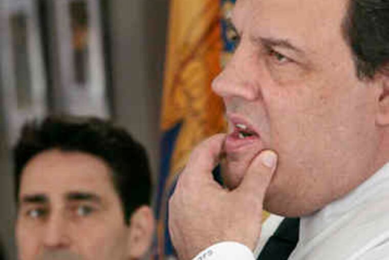 Though it will make his job tougher, Mayor James Keenan (left) of Mount Laurel says Gov. Christie's proposed cuts in state aid are necessary. Christie was at the township library to push his plan.