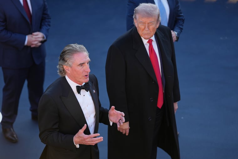 President Donald Trump listens as Interior Secretary Doug Burgum speaks at the Lincoln Memorial Reflecting Pool during a visit to to see the new blue protective coating being applied as part of a renovation project, Thursday, May 7, 2026, in Washington.