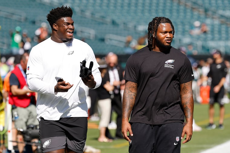 Eagles defensive tackle’s Jordan Davis, left, and Jalen Carter during warm ups before the Eagles played the Denver Broncos on Sunday, October 5, 2025 in Philadelphia.