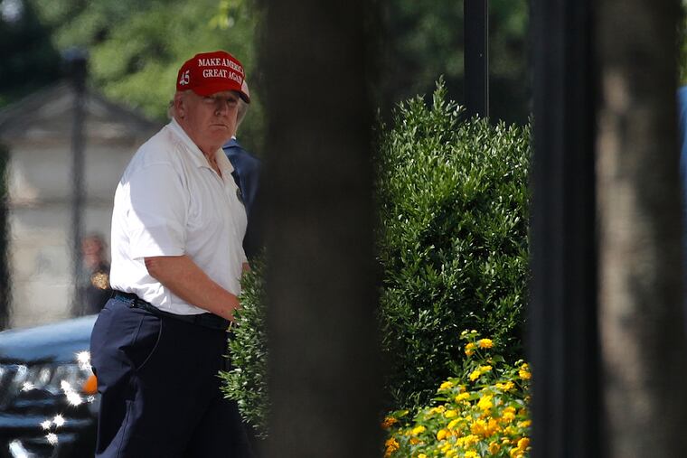 President Donald Trump arrives at the White House on Sunday, after visiting Trump National Golf Club in Sterling, Va.