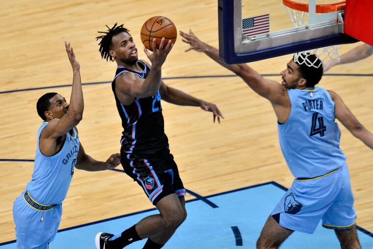 Would Kings guard Buddy Hield (center) make the 76ers better?