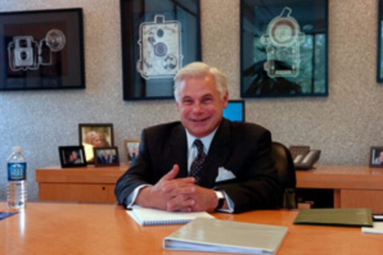 Michael Kalogris, CEO of SunCom Wireless, at the Berwyn headquarters. Before a car accident in May 2006 that nearly killed him, his wireless network firm had been trying to restructure crushing debt. After the crash, Kalogris tapped rehab strengths to create deals and avert bankruptcy.