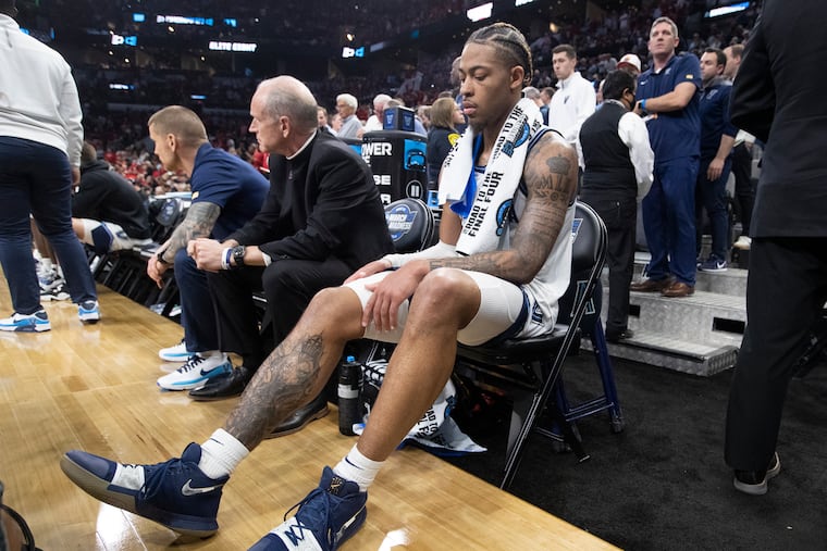 Justin Moore of Villanova sits on the bench after getting injured in the South Regional championship game in the NCAA Tournament on March 26, 2022 at AT&T Arena in San Antonio, Texas.
