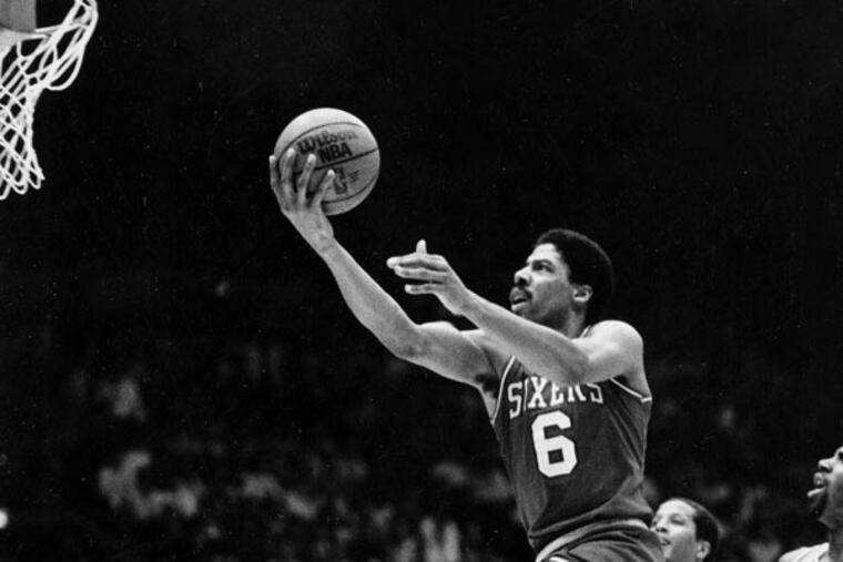 In this May 31, 1983 file photo, Philadelphia 76ers center Julius "Dr. J" Erving goes up for two points near the end an NBA Championship playoff game against the Los Angeles Lakers in Los Angeles. (AP file photo)