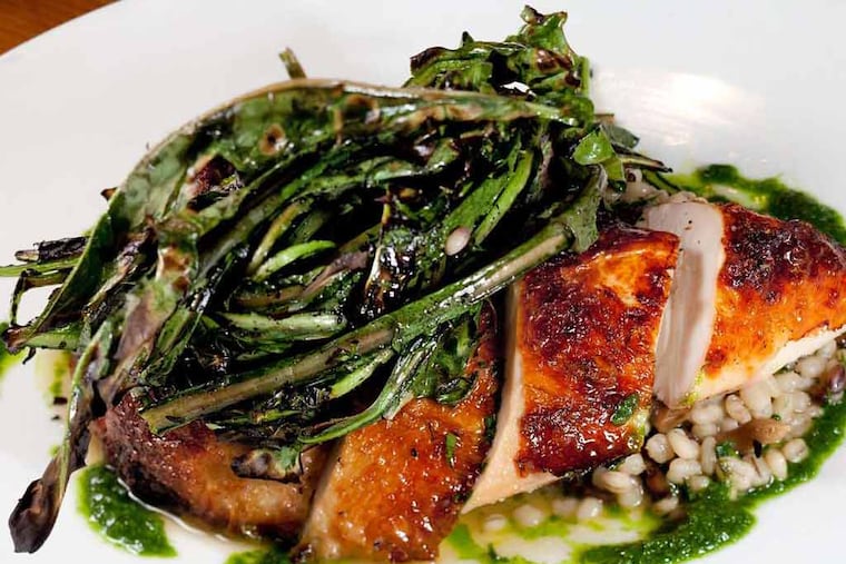 Roasted Lancaster chicken with smoked mushroom barley and dandelion greens, from the restaurant week menu at Pub & Kitchen,1946 Lombard St., Philadelphia. ( DAVID M WARREN / Staff Photographer )