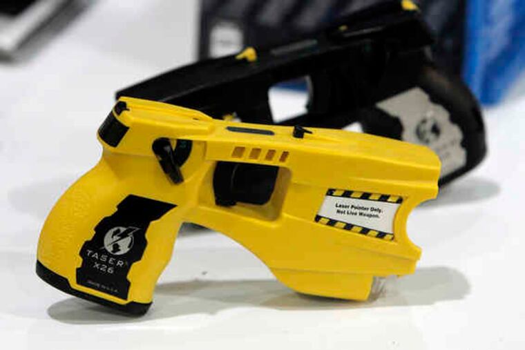 A Taser-like device was used by a security guard on South Street early Saturday, causing a man's clothes to burst into flames.