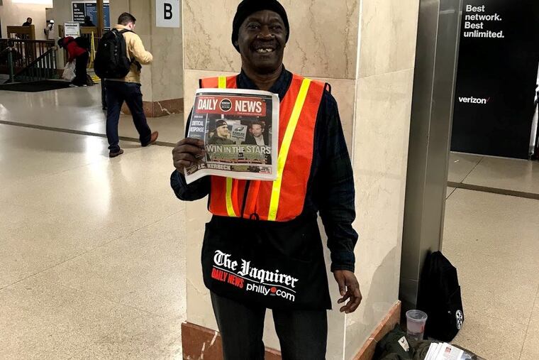 Ken Worth hawks the Inquirer and Daily News at Suburban Station, in front of one of two newsstand-bookstores that recently closed.
