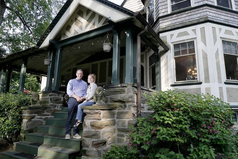 Dana and Matthew Walker on the front steps of their Wyncote home. They spotted it while looking at a house for sale across the street.