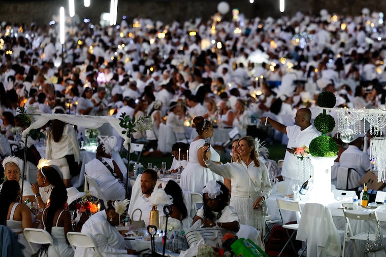 Diners during the 13th rendition of Le Diner en Blanc at Girard College on Thursday, August 21, 2025.