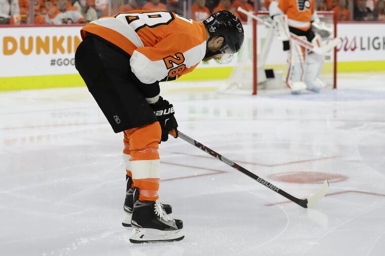 Flyers center Claude Giroux, shown here after committing a penalty in Game 3, has not scored a goal in his last 11 playoff games.