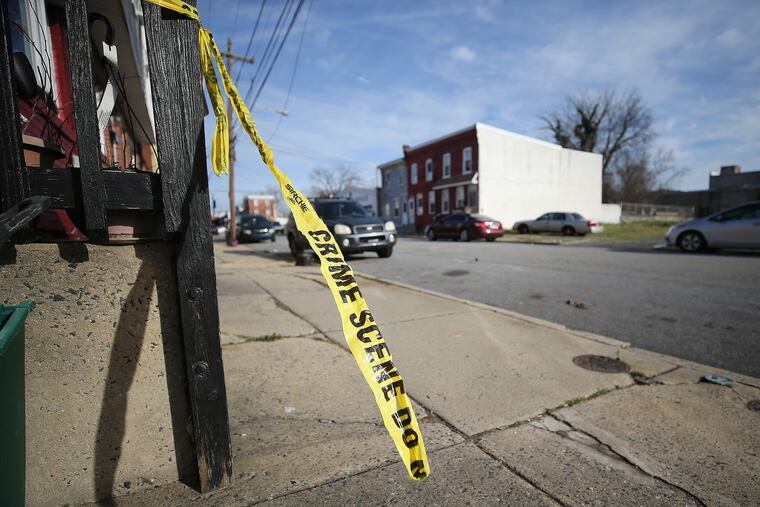 A piece of crime scene tape remains along the 200 block of Broomall Street in Chester on March 11, 2020, a day after a shooting there left two teens dead and two others wounded.