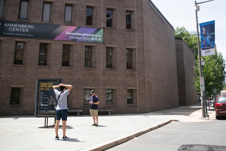 People stand in front of the Annenberg Center for the Performing Arts at 36th and Walnut in Philadelphia on Friday, June 25, 2021. The Annenberg Center is changing the name of its organization. The physical center will continued to be called the Annenberg Center for the Performing Arts, but the series it runs will be called “Penn Live Arts.”