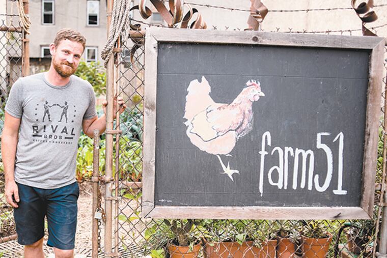 Farm 51 co-owner Andrew Olson has established the 6,000 sqaure foot operation between two row homes six years ago. He owns half of the land, and is fighting to maintain the right to farm the other half, which is about to be put up for sale. Pennsylvania. ( MATTHEW HALL / Staff Photographer )