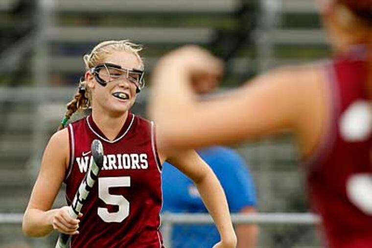 West Chester Henderson's Katie O'Donnell celebrates after scoring two goals in a win over Downingtown West. (Ron Cortes/Staff Photographer)