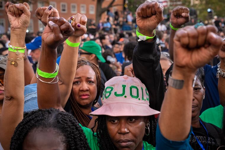 Supporters of Democratic presidential nominee Vice President Kamala Harris hold up their fists in the air in unison after she delivered a concession speech after the 2024 presidential election, Nov. 6, 2024, on the campus of Howard University in Washington.